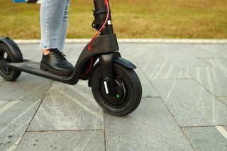 Close up of the wheels on an unbranded e-scooter