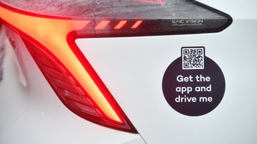 Close up of a Co Wheels car club vehicle back corner with QR code to book the car