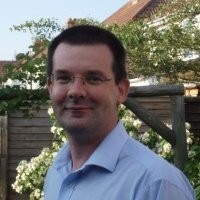 Tim Caswell standing in a garden